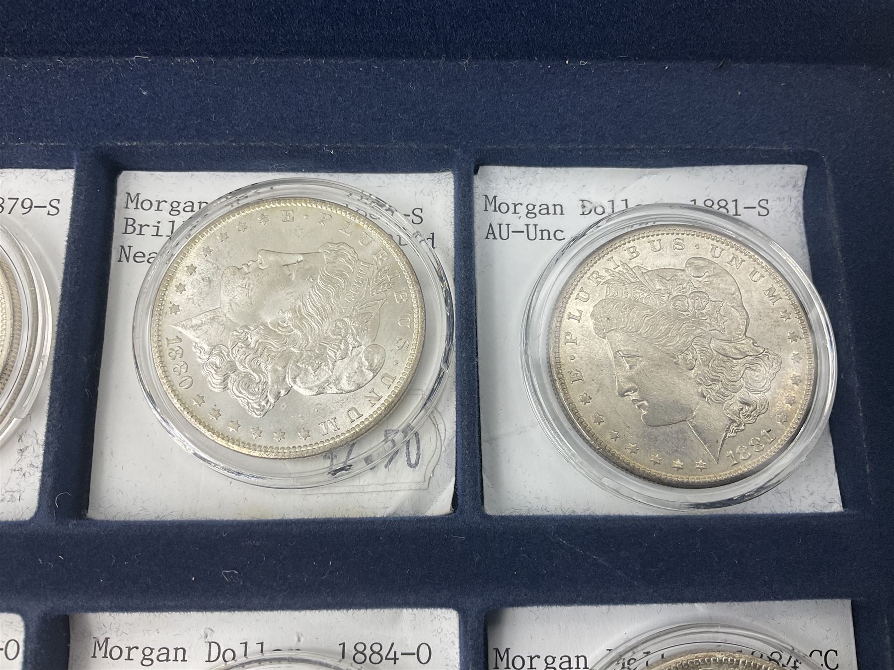 Twelve United States of America silver Morgan dollar coins, dated 1878 S, 1879 S, 1880 S, 1881 S, 1882 O, 1883 O, 1884 O, 1884 CC, 1885 O, 1886, 1887 and 1888