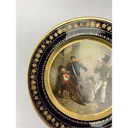 19th century Rihouet Paris porcelain cabinet plate, decorated with a central panel illustrating three French soldiers around a bottle laden table, one surveying a note, within a dark blue gilt detailed border, with French inscription verso, and red printed mark Rihouet Rue de la Paix A Paris and green fish mark, possibly for Perche, D23cm 



