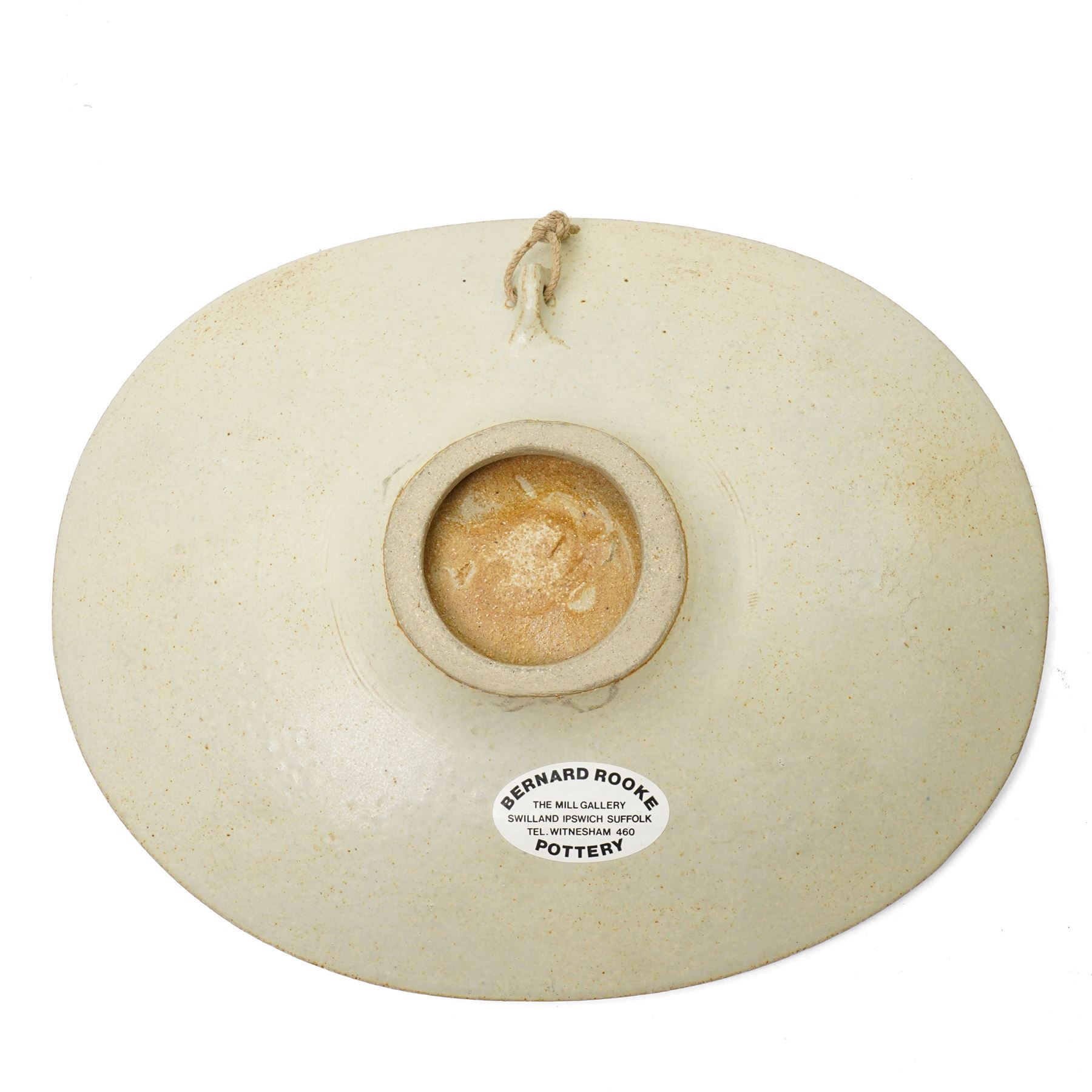 Bernard Rooke (1938-) - Studio pottery dish of shaped oval form with a raised pattern of lily pads and frogs W29cm with Bernard Rooke paper label and purchased from The Mill Gallery, Swilland, Ipswich and inscribed 'B R'