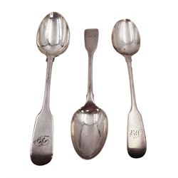 Three Victorian York silver Fiddle pattern teaspoons, each with engraved monogram, two a pair and one other, all hallmarked James Barber, York 1855