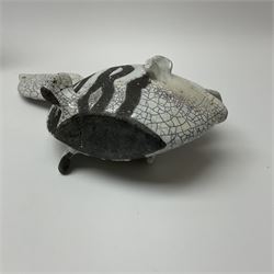 A studio pottery model of a fish, with Snowden pottery Christopher John stamped beneath, H17cm together with a large studio pottery bowl with painted fish design on a dark blue ground, D31.5cm. 