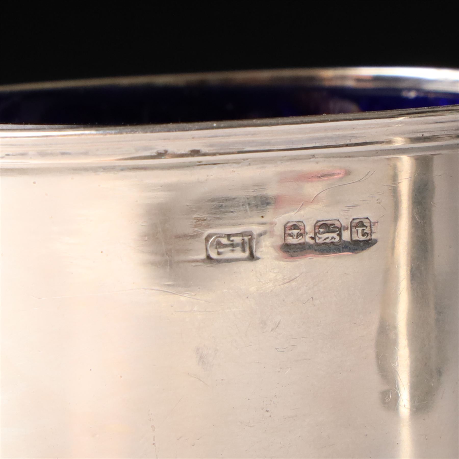 Victorian silver baluster mustard pot with engraved decoration London 1844, pair of silver oval salts and matching mustard  Birmingham 1918 and a circular mustard pot