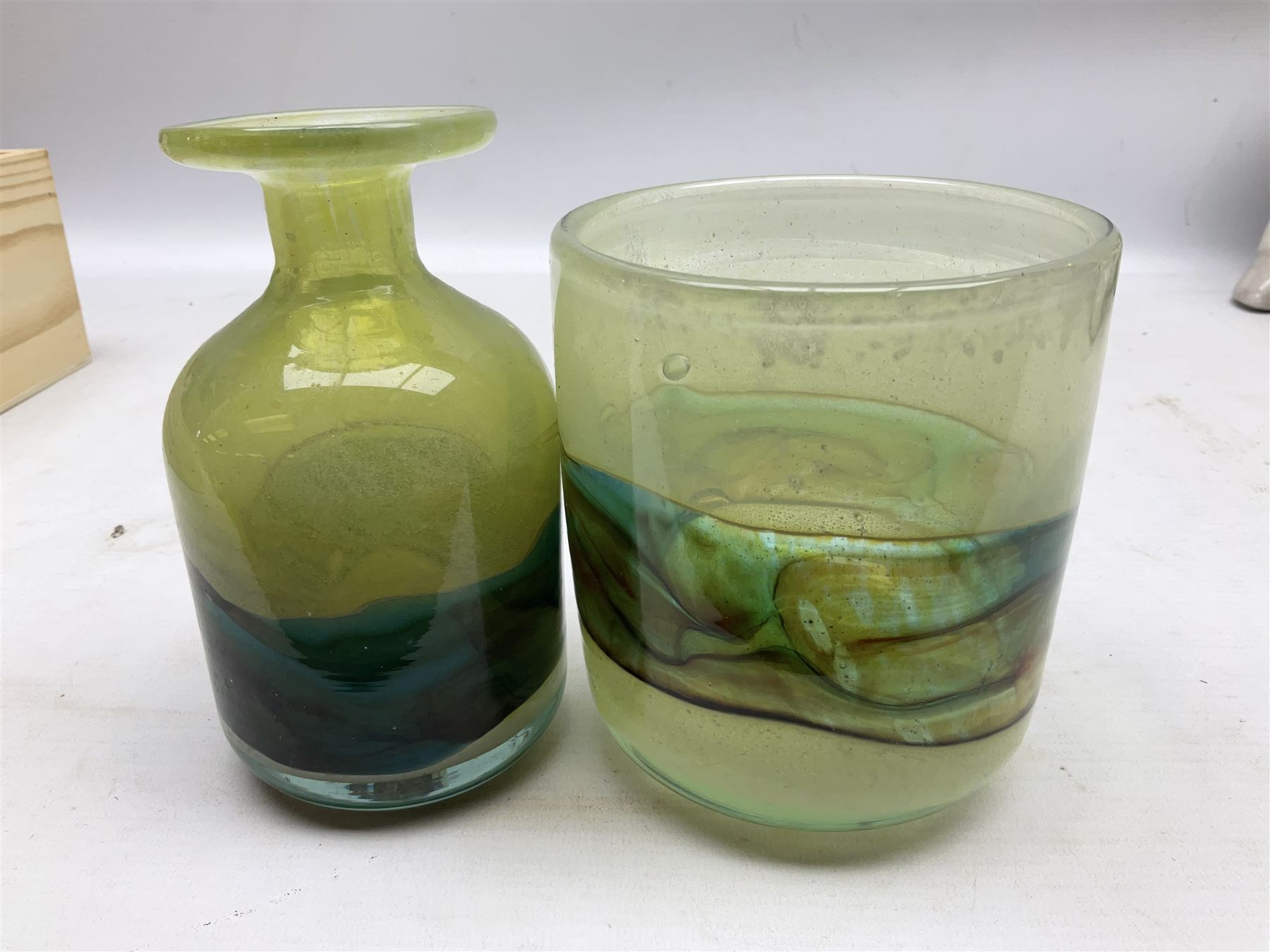 Mdina sea and sand glass vase, of cylindrical form, decorated in green, turquoise and brown, and matching vase, both unmarked together with a glass bowl and jug with gilt decoration 