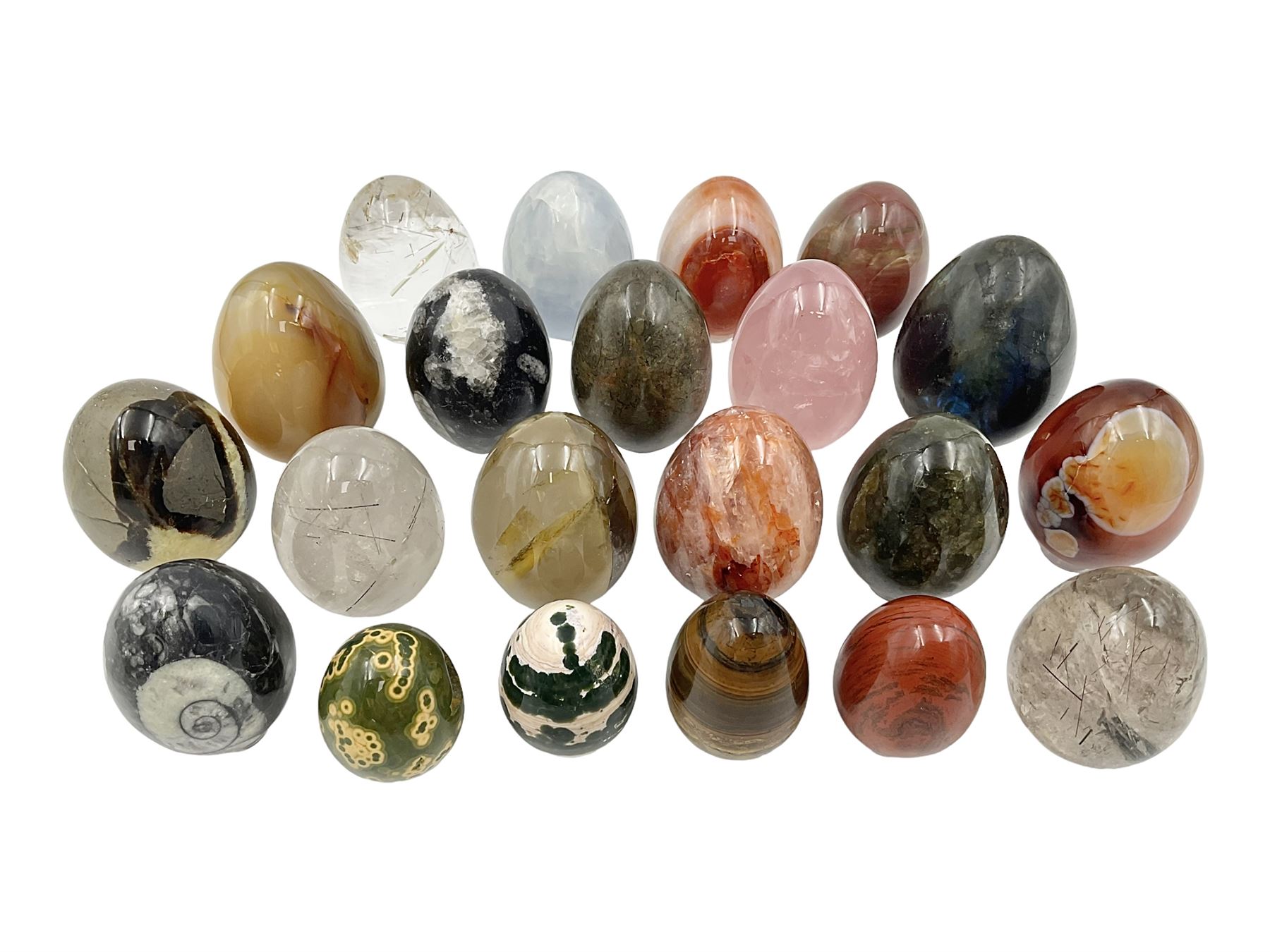 Collection of twenty-one hardstone specimen eggs, including labradorite, calcite, orbicular jasper, tiger's eye, smokey quartz, fossilised wood etc, originally part of the collection of the late Stanley J Seeger
