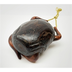 A Japanese carved soft wood inro, modelled as a streching and yawning figure, possibly Daruma, detailed with insect, inset mother of pearl butterfly, and glass eyes, H10cm. 