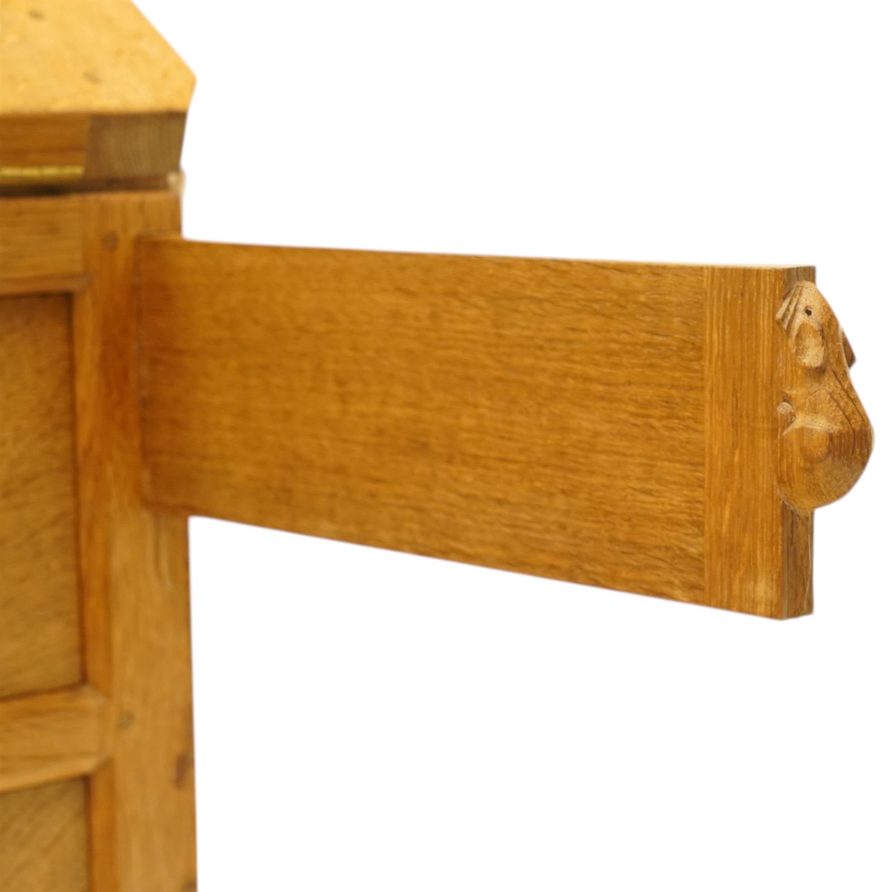 Mouseman - oak adzed bureau, fall front with carved mouse lopers, with fitted interior, above two short over two long drawers, by the workshop of Robert Thompson of Kilburn
