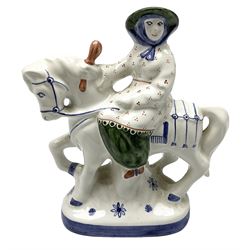 Rye pottery figure modelled as a lady upon a horse, with printed marks beneath, H19cm