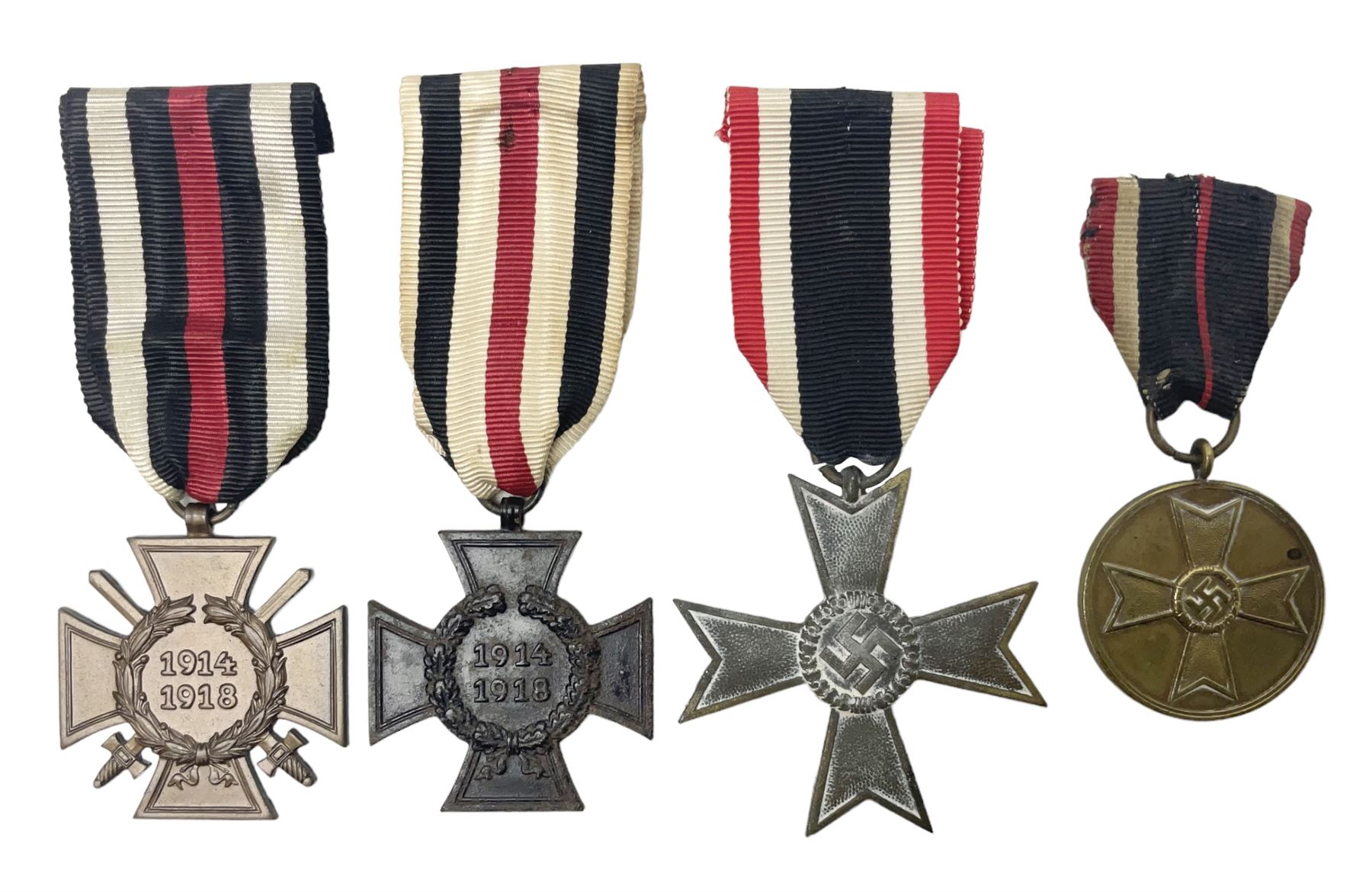 Two WW1 German medals - copy Cross of Honour with swords (combatants); Cross of Honour without swords (non-combatants); and two WW2 German medals - War Merit Medal; and War Merit Cross; all with ribbons (4)