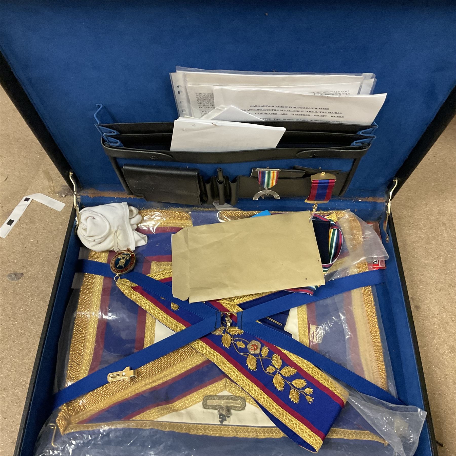 Masonic regalia, including sword, kid leather gloves and apron, Order of Holy Wisdom high priest mitre, etc, contained within briefcases and boxes 