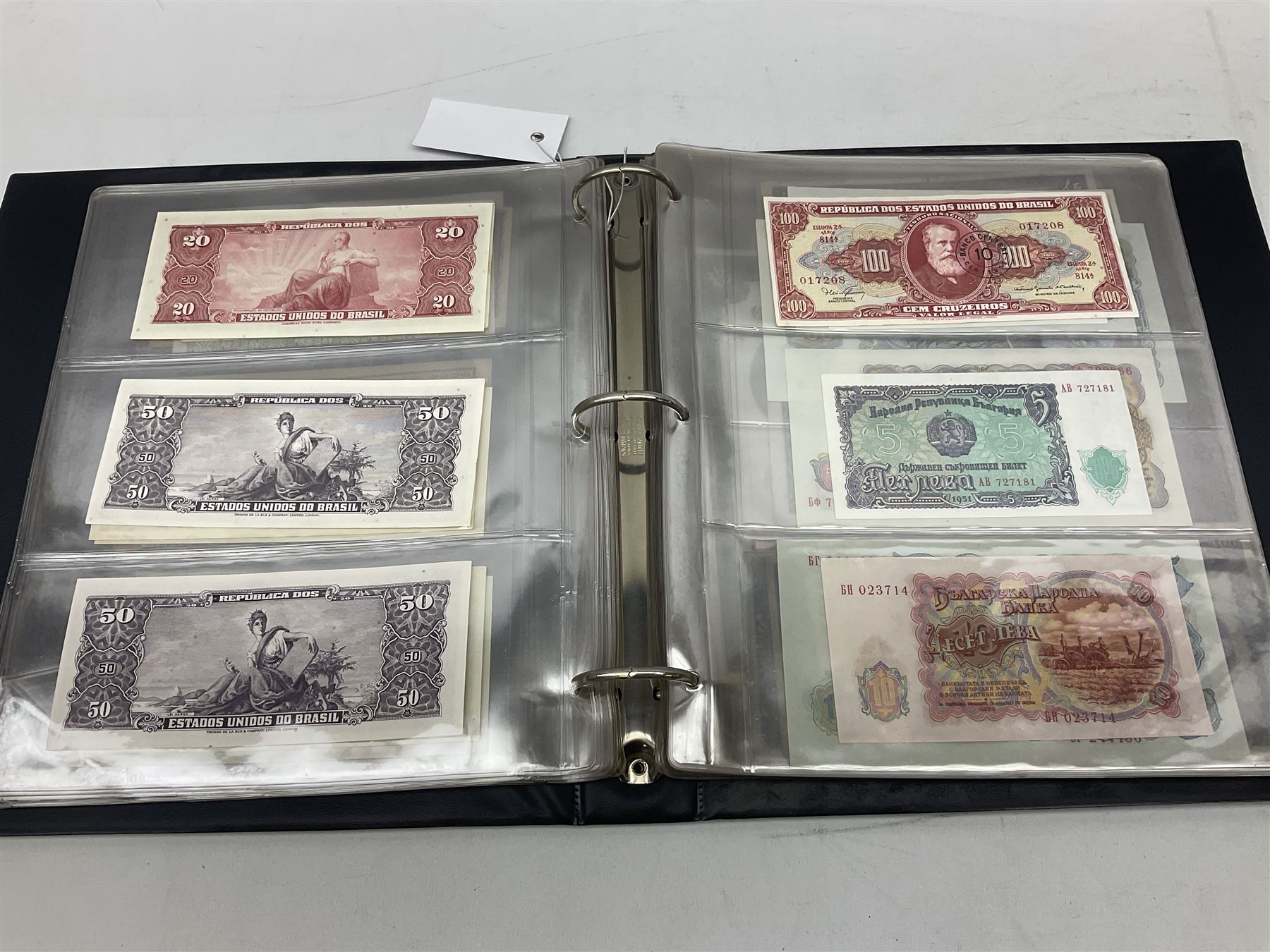 World banknotes, including Queen Elizabeth II The States of Jersey one pound 'DB202703', five pounds 'BB527762' and ten pounds 'AB651481', reserve bank of New Zealand two dollars '1L3 741894', King George V Straits Settlements one dollar 1st January 1935 'F/83 28924', various Bank of England notes etc, housed in two ring binder albums