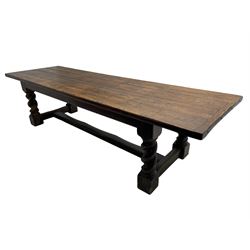 Large 19th century pine refectory dining table, cleated and pegged rectangular plank top over moulded skirt rails, on spiral turned and block supports joined by moulded H-shaped stretchers
