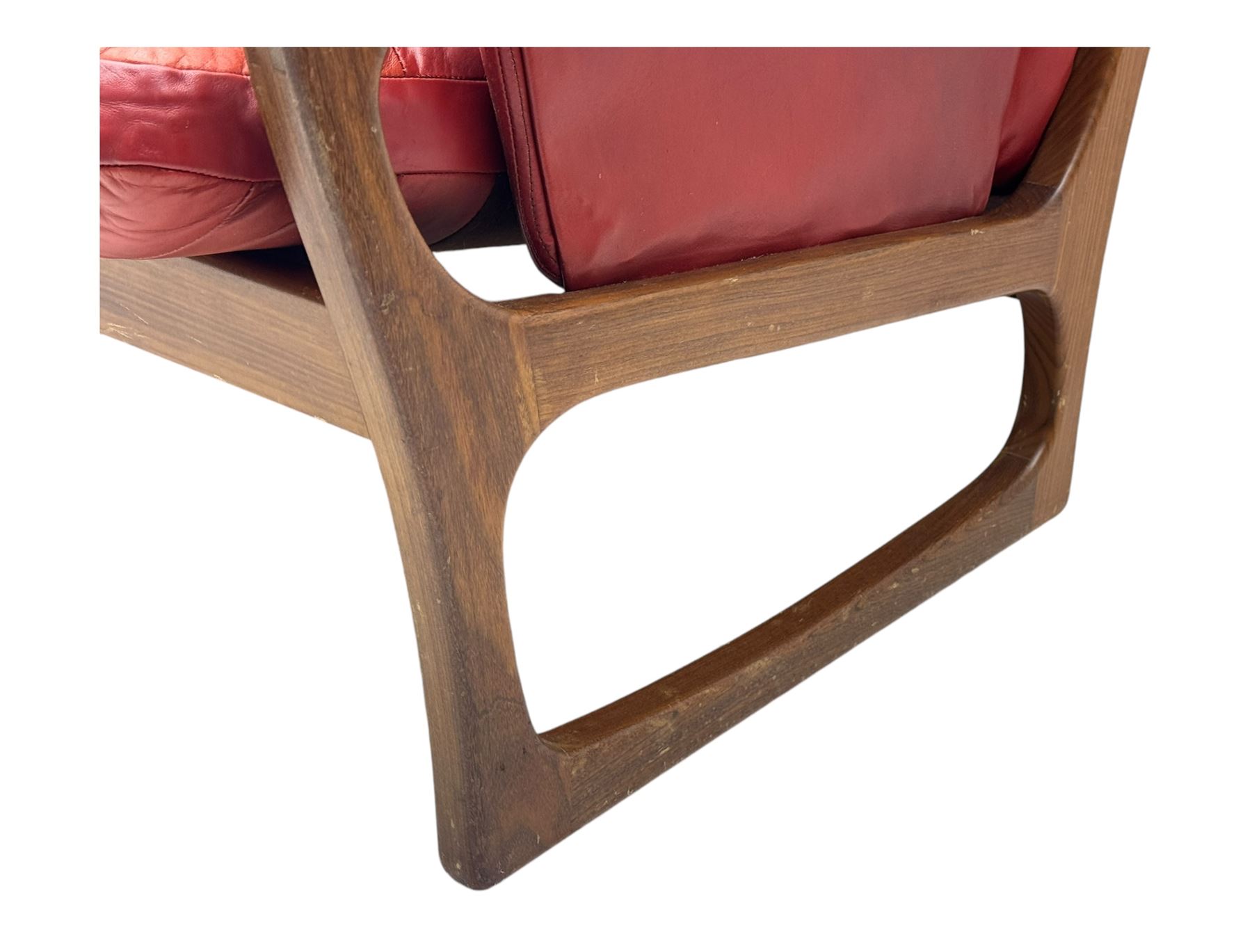 Folke Ohlsson for Gimson & Slater - mid-20th century Danish teak-framed sofa, red leather upholstery with patchwork design, raised on shaped teak side supports