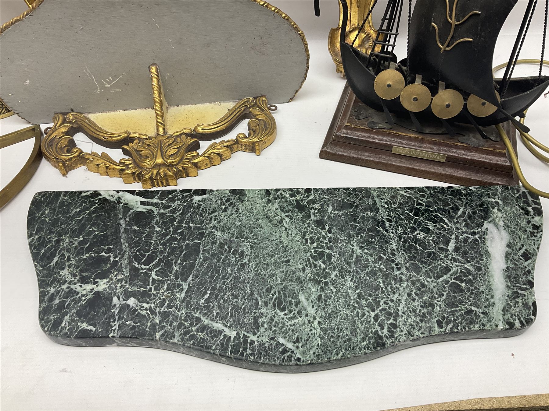 Five various giltwood and other hall brackets, one with marble top; and Viking ship table lamp