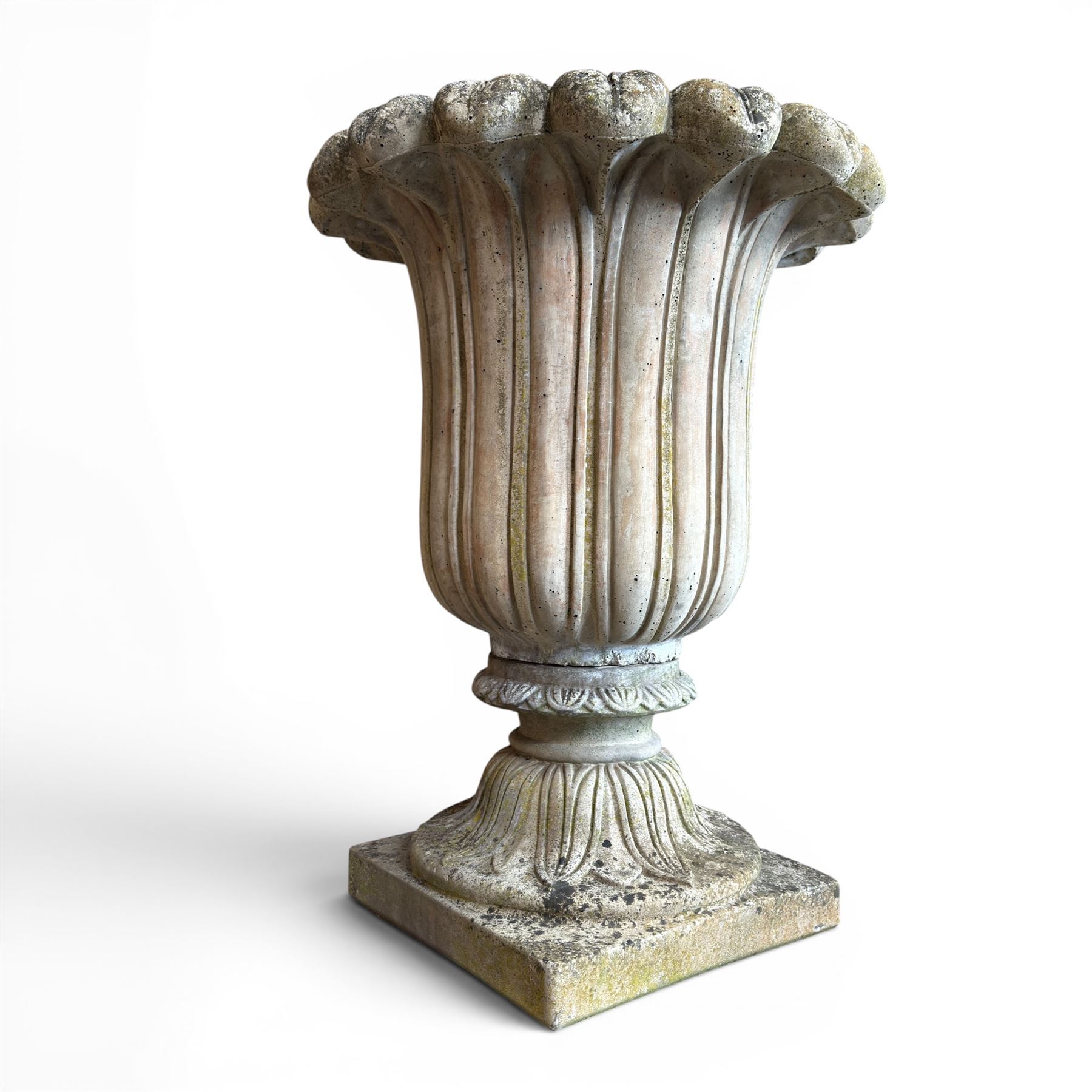 Cast stone tulip urn, petal rim with bell shaped bowl on squat base, stamped HGC; with associated plinth (2)