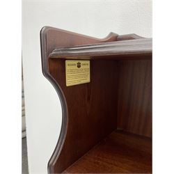 Rossmore Furniture - mahogany bookcase fitted with four shelves, shaped end supports