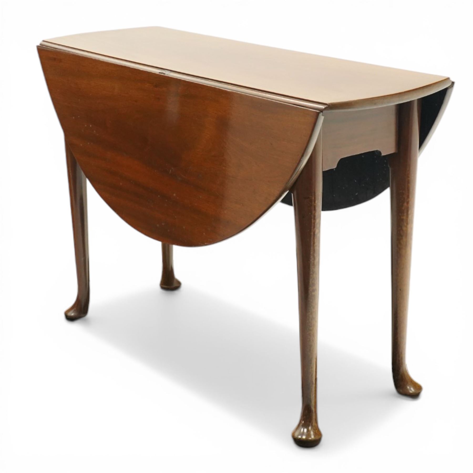 Mid 18th century mahogany pad foot drop leaf table, the circular top with gate leg action, freshly polished throughout