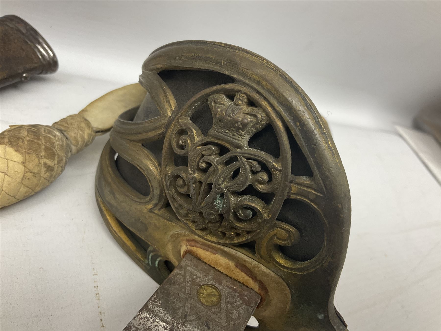 Victorian British Army officer's sword by Hobson & Sons Little Windmill Street London, the 82cm fullered steel blade etched with crowned Victoria cypher and 'HM 1st West York R.V.', lined gilded brass three-bar hilt incorporating Victoria cypher and wire-bound fish skin grip with plaited knot; in steel scabbard with two hanging rings L99cm overall