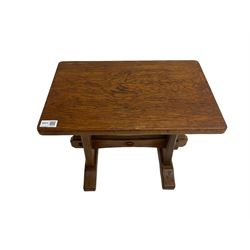 Acornman - oak occasional or side table, rectangular adzed top on shaped end supports joined by pegged stretcher on sledge feet, by Alan Grainger of Brandsby