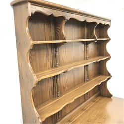 Ercol Old Colonial elm dresser, Golden Dawn finish, raised three tier plate rack above three drawers and three cupboards, stile supports, W147cm, H193cm, D52cm