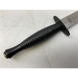Gulf War period commando knife with 17cm double-edged steel blade etched with the crest and motto 'By Strength and Guile', blackened cross-piece and grip; in webbing scabbard L31cm overall