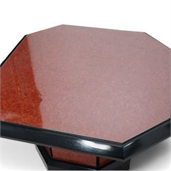 1980s figured wood finish and black lacquered coffee table, square canted top with chamfered edge, on canted pedestal with plinth base 