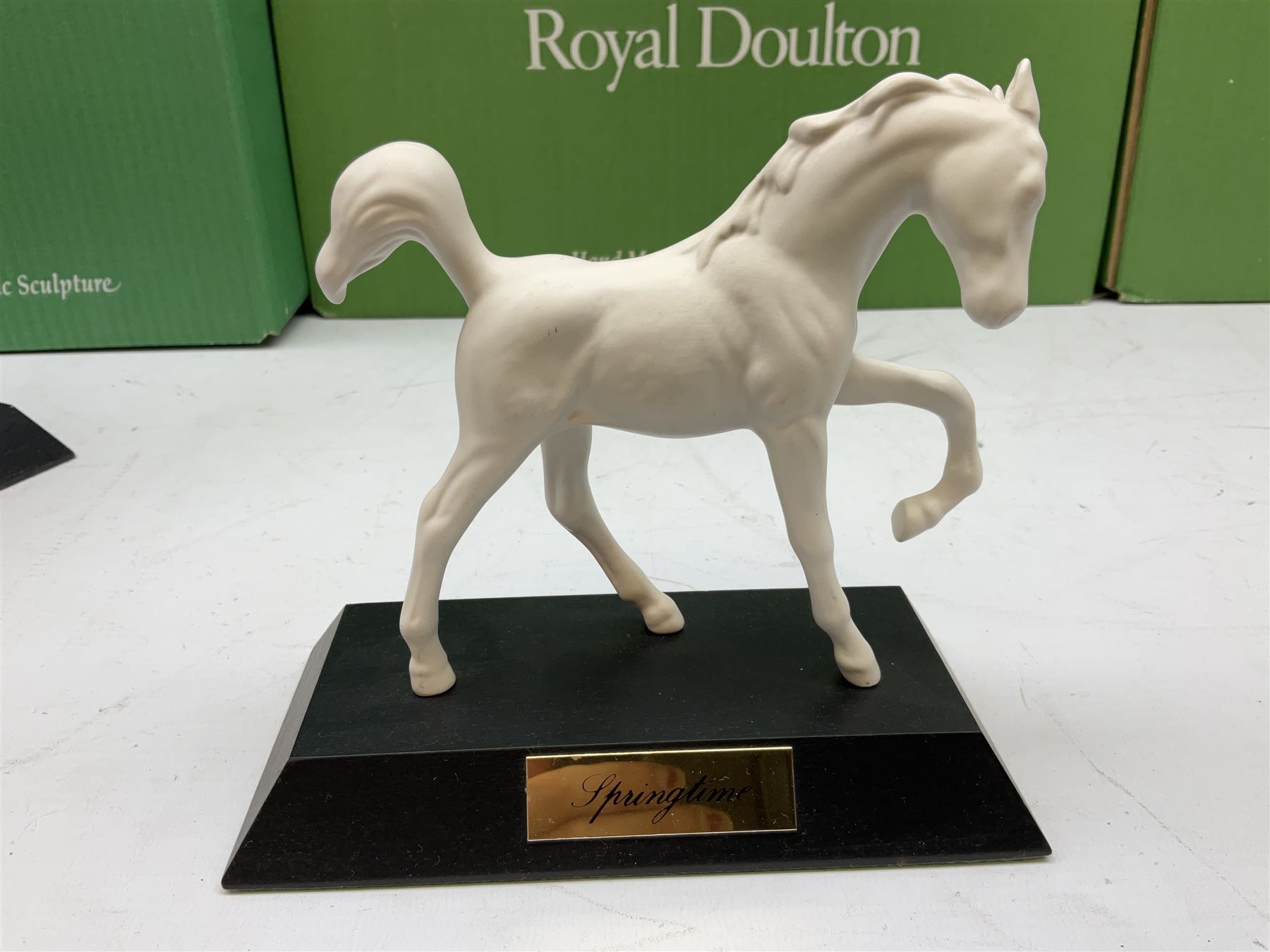 Five Beswick and Royal Doulton horse figures in matt white on black plinths, comprising of  Spirit of Affection no. 2689/2536, Springtime no.2837, Spirit of peace no.2916, Spirit of earth no.2914 and Spirit of the wild no. 183, together with a composite figure of a horse (6)