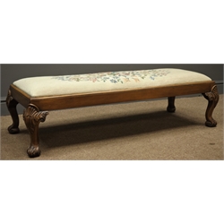  Queen Anne style walnut footstool, rectangular needlework upholstered drop in cushion, shell and acanthus carved cabriole feet, W113cm  