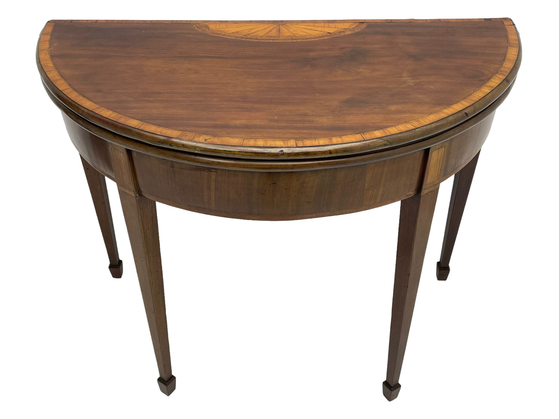 George III inlaid mahogany card table, demi-lune fold-over top with satinwood band and large fan motif, baize lined interior, double gate-leg action base, on square tapering supports with spade feet