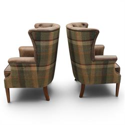 Pair of Georgian design wingback armchairs upholstered in brown leather and tartan tweed fabric, button back and scrolled arms with brass studded trim, square tapered supports