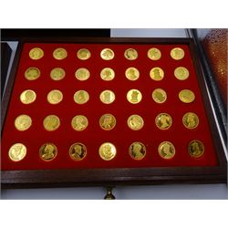 Danbury Mint, Our Royal Sovereigns Collection, seventy 22 carat gold plated silver medallions depicting the complete line of British monarchs to mark the 1200th anniversary of the first coronation, contained within wooden table top collectors cabinet with two drawers, with certificate of authenticity, with two drawers, hallmarked Danbury Mint, London various dates