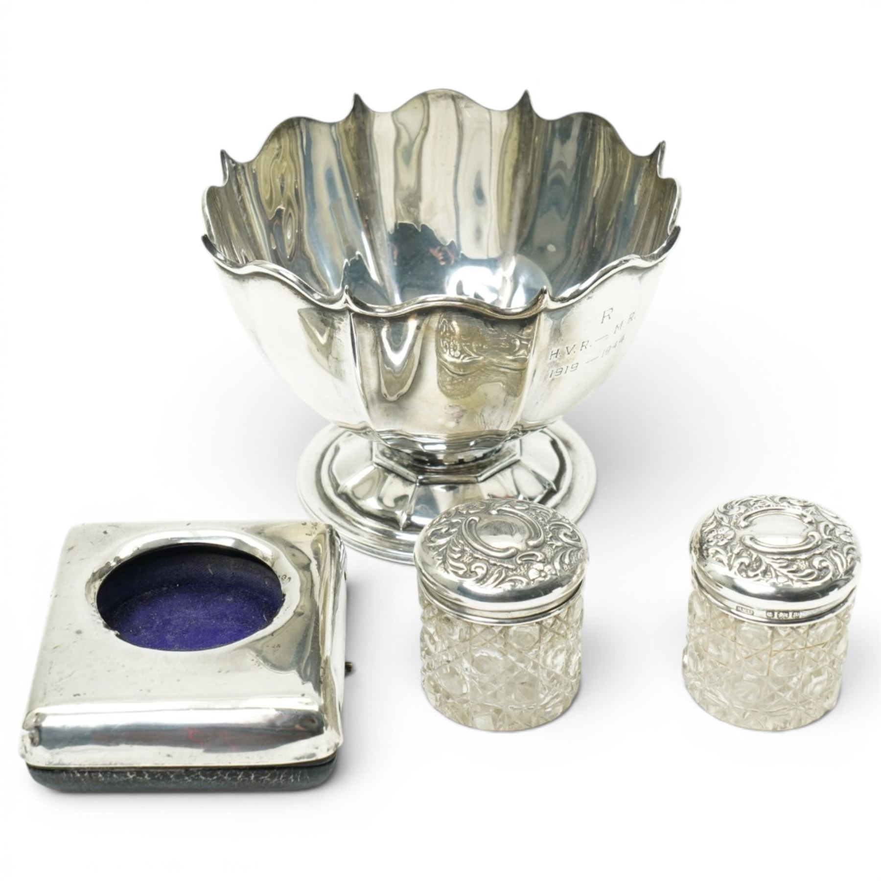 Silver bowl on short pedestal foot D11.5cm, small silver bedside clock case and two glass toilet jars with silver lids