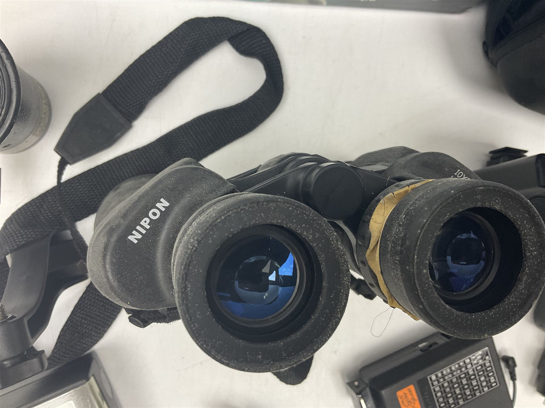 Yukon rubber armoured compact variable power spotting scope (boxed), together with Bresser 10x50 binoculars, Bushnell Excursion 10x42 binoculars, camera equipment etc  