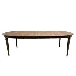Mid-20th century walnut and elm oval extending dining table with two additional leaves