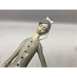 Seven Lladro figures, comprising Playful Puppy no 9135, Platero and Marcelino/Boy Hugging Donkey no 1181, Mini Seal Family no 5318, Attentive Polar Bear no 1207, Seated Polar Bear no1209, Eskimo Boy with Pet no 5238 and Girl with Geese no 1035, together with Nao goose