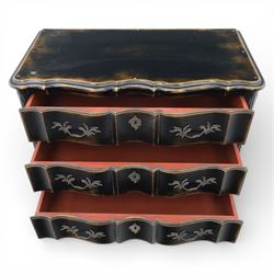 French style black lacquered chest of drawers, the serpentine front fitted with three graduated drawers mounted with scrolling foliate metal handles and key plates, shaped apron and scrolled cabriole legs