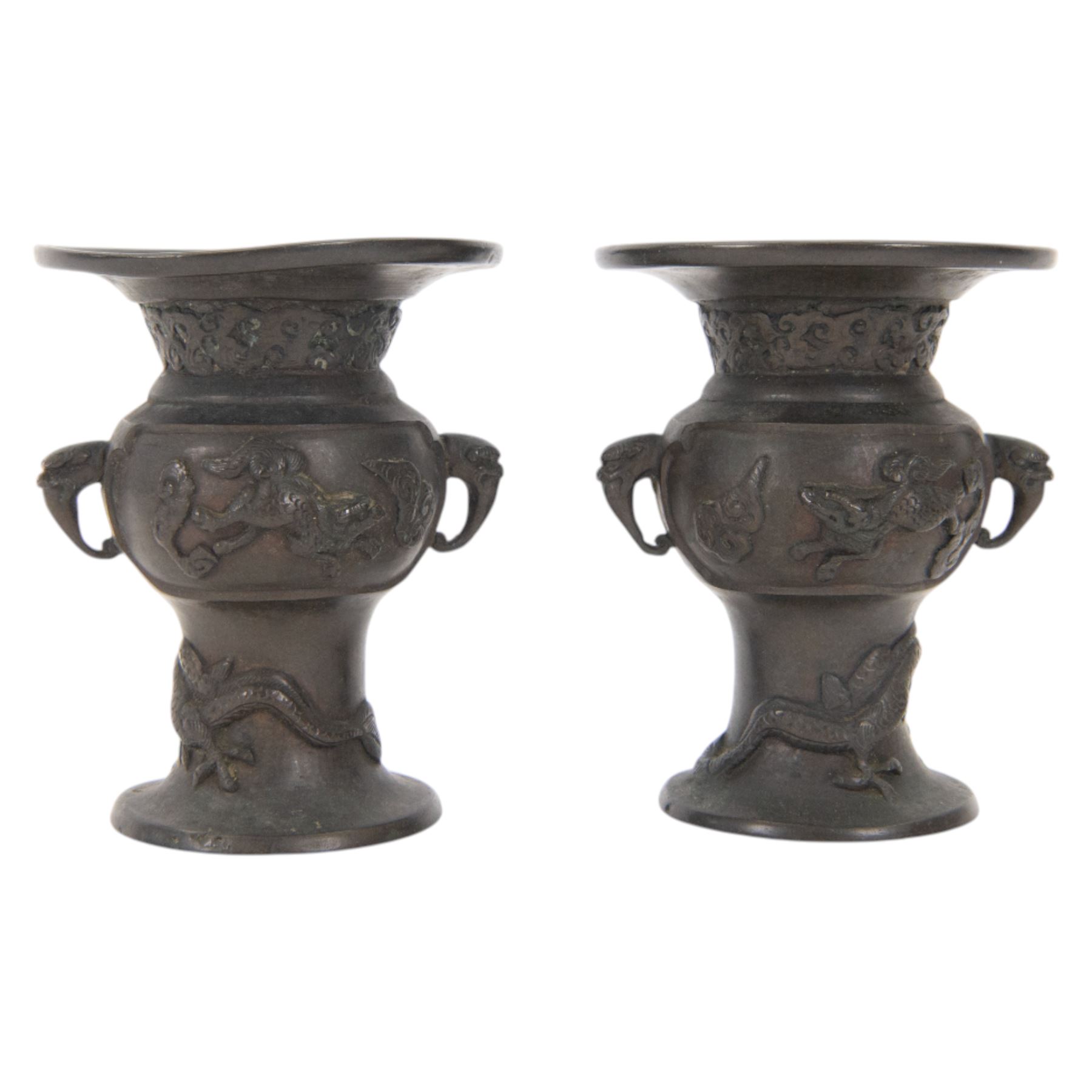 Pair of Japanese bronzed vases, decorated in relief with with birds and dragons, with dragon head handles, H13cm
