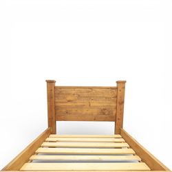 Alexander Ellis of Beverley - rustic pine king sized bed, of plank form construction with visible dowels, raised on stile supports