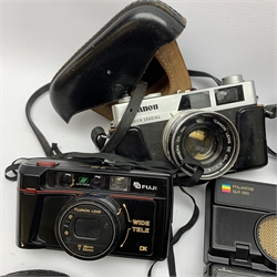 Collection of cameras to include: Polaroid 600 Land Camera SLR 680 with auto focus/auto strobe, Rollei XF 35, Canon ML AF35, Fuji TW-300, Balda Baldina Compur-Rapid, YASHICA LYNX-5000, Canon Canonet QL19, flash bar and two light meters in one box