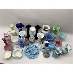 A group of mostly Victorian glassware, to include a number of Satin glass vases, a pair of moulded slag glass vases, a Sowerby blue milk glass lattice plate, and three Sowerby blue milk glass baskets, a selection of painted opaque and milk glass vases, etc. 