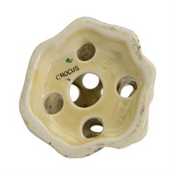 Royal Staffordshire Crocus by Clarice Cliff teacup and saucer, with printed mark beneath, together with a Clarice Cliff Crocus pattern flower frog, with printed mark beneath, cup H6cm