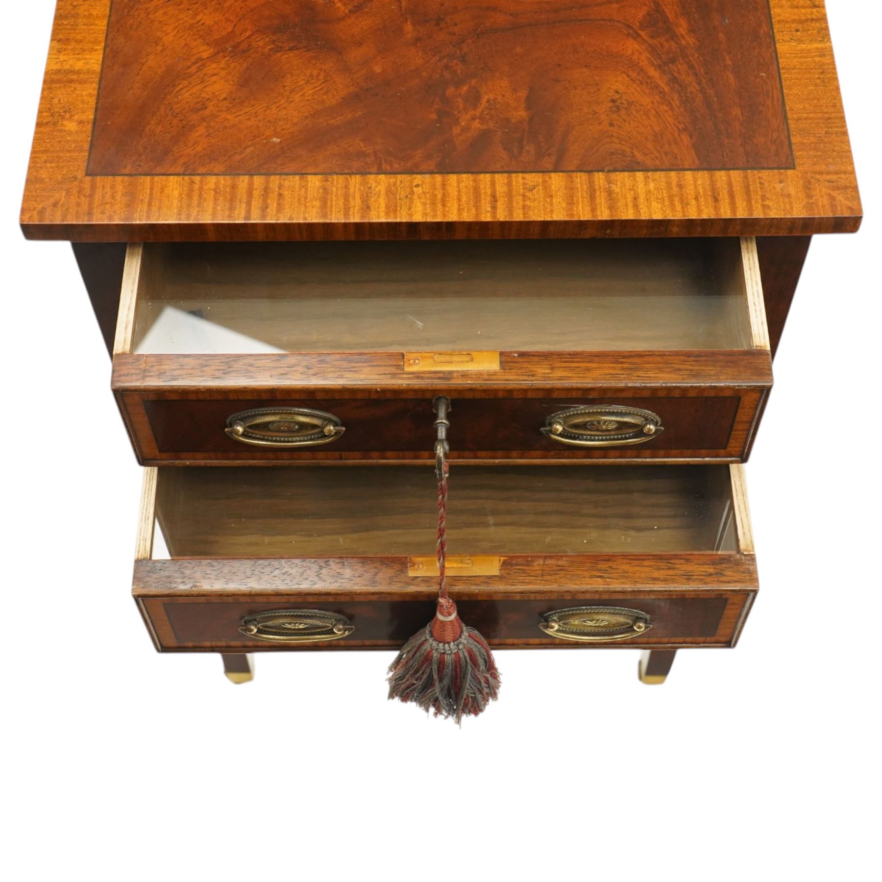 Georgian design inlaid mahogany collectors table, rectangular cross-banded top, fitted with two cock-beaded display drawers with interior glazed tops, with opposing faux drawers, fitted with pressed brass handle plates, on square tapering supports with castors, with keys