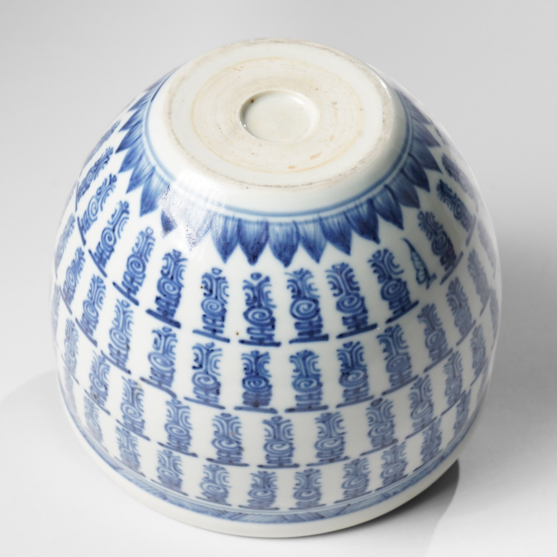 Chinese fish bowl, painted profusely with repeating symbols in blue, on hardwood stand, unmarked, including stand H16cm