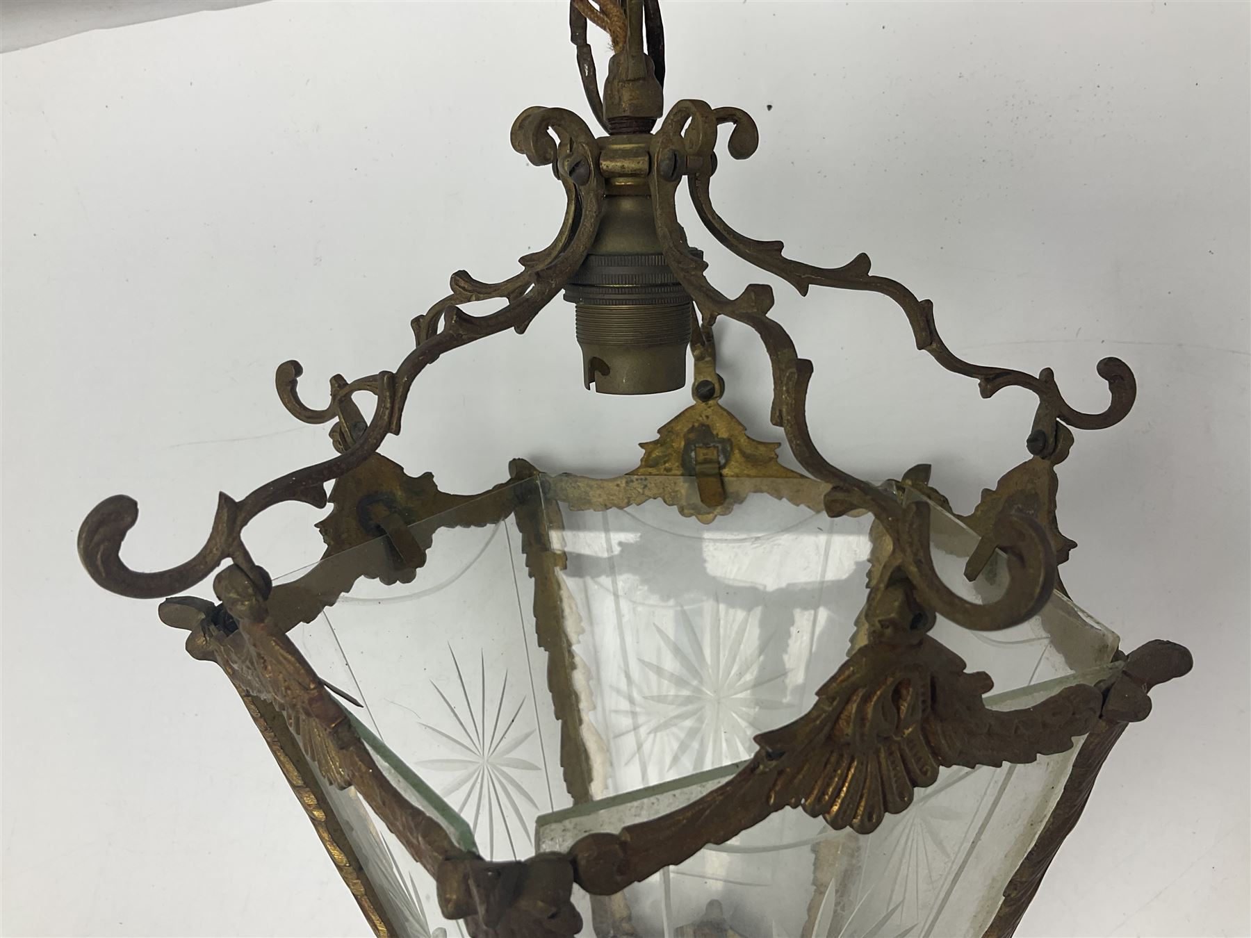 Edwardian floral cast gilt brass hall lantern of tapered pentagonal form, the five glass panels with etched decoration, overall approx L36cm excl chain