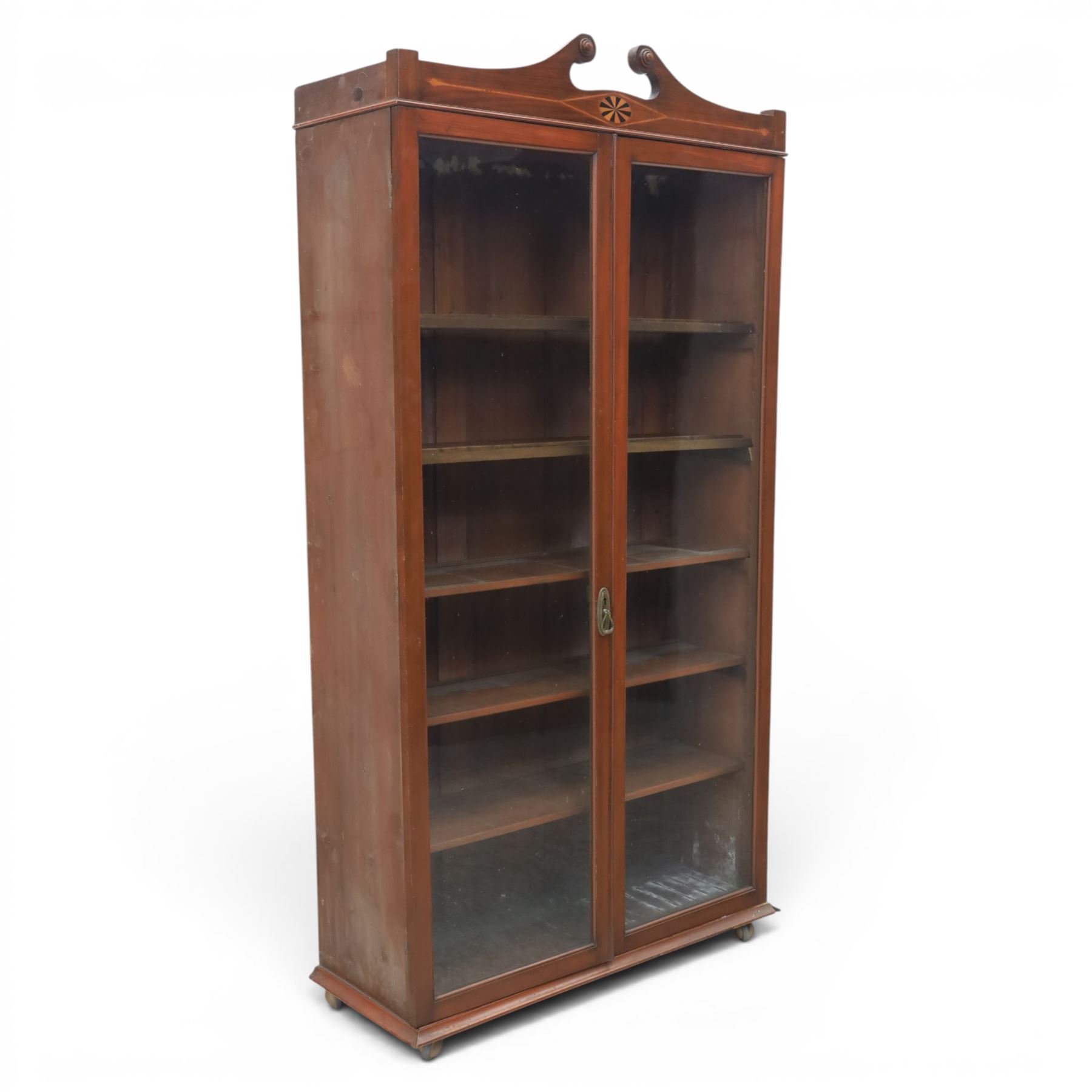 Edwardian walnut bookcase, fitted with two full height glazed doors, inlaid detail with checkered motif, adjustable shelves