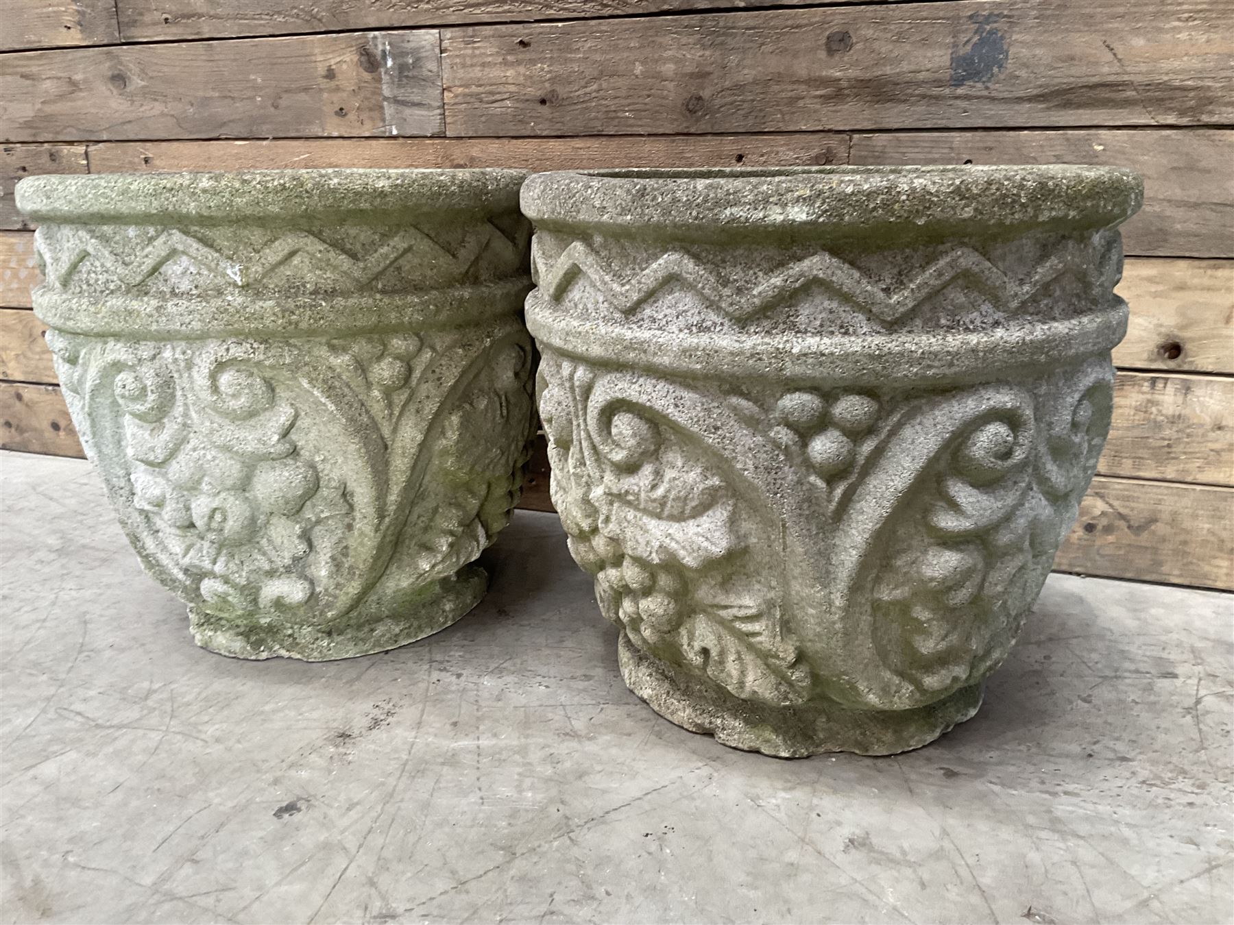 Pair of cast stone ornate circular planters