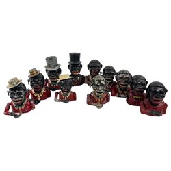 Collection of cast iron Jolly money boxes with and without hats