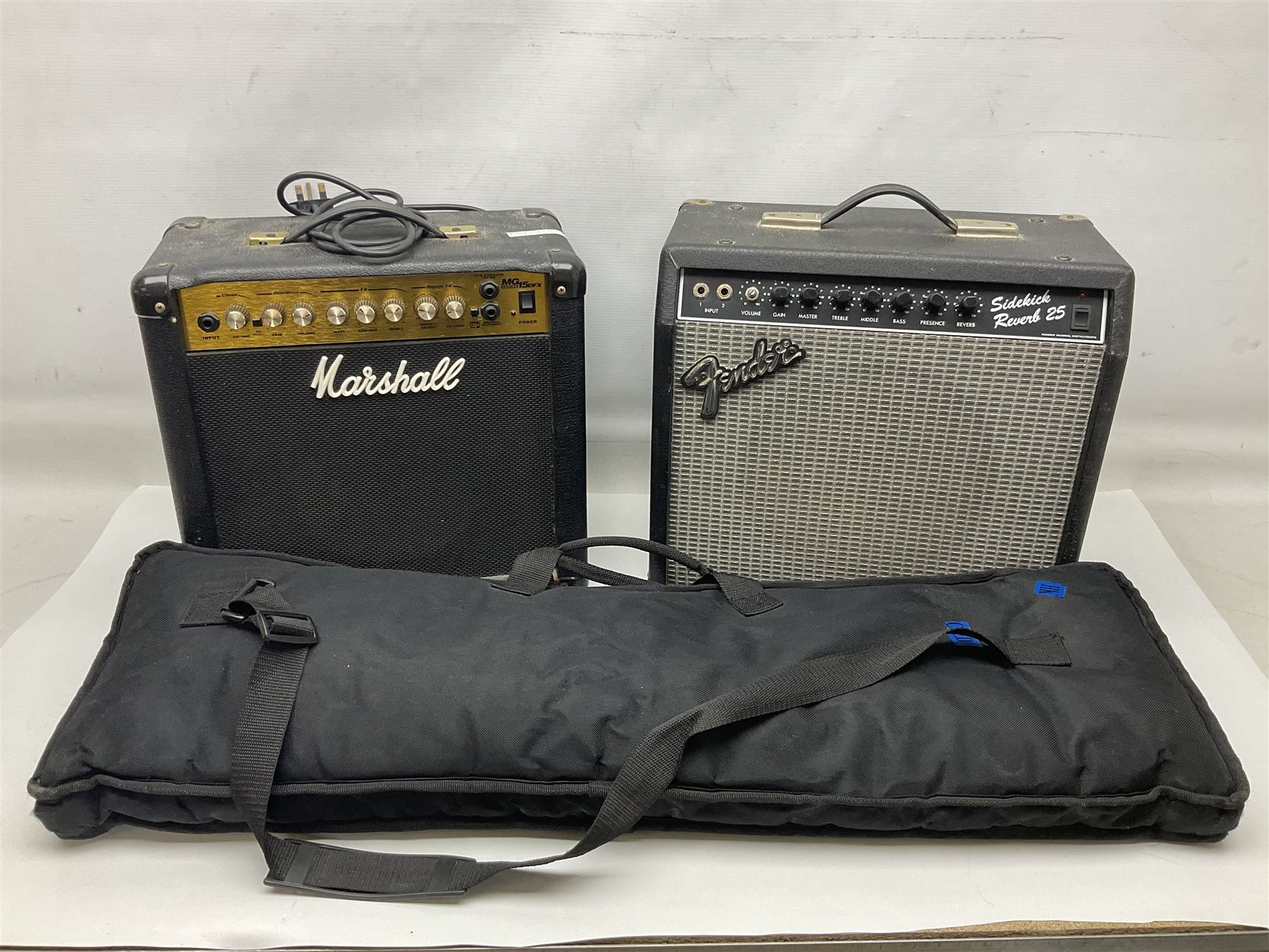 Aria Sinsonido mahogany electric travel guitar, serial no.0502385 L86cm; in original gig bag with earphones and GM11 Minituner; together with Fender Sidekick Reverb 25 amplifier and Marshall MG Series 15DFX amplifier (3)