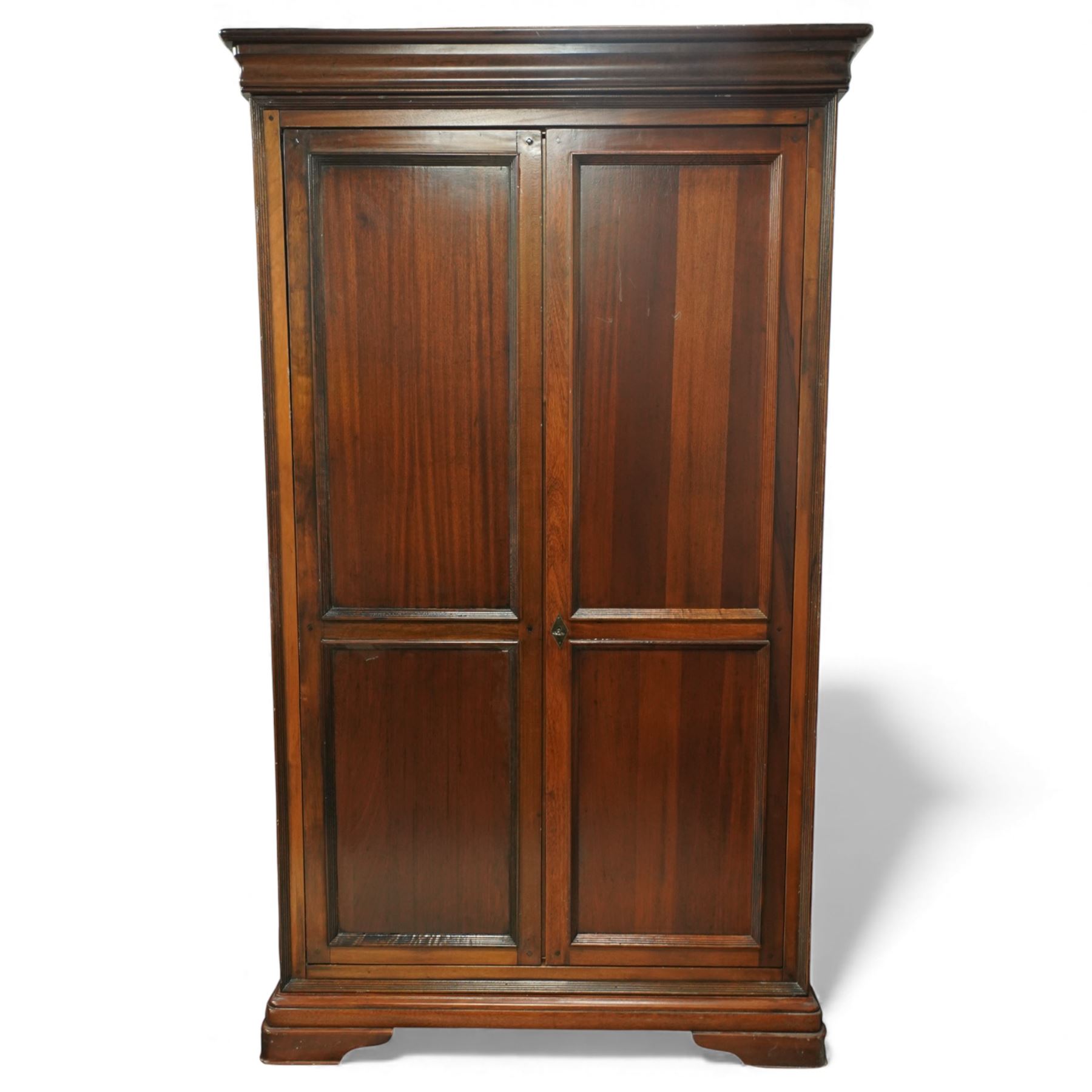Willis & Gambier - French cherry wood double wardrobe, moulded cornice above two panelled doors opening to a hanging interior with rail and shelf, raised on bracket feet