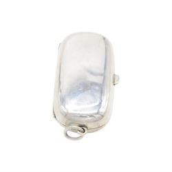 Edwardian silver sovereign holder, of plain oval form, the hinged cover opening to reveal two spring loaded recesses, hallmarked Dennison Watch Case Co, Birmingham 1910, L5.5cm