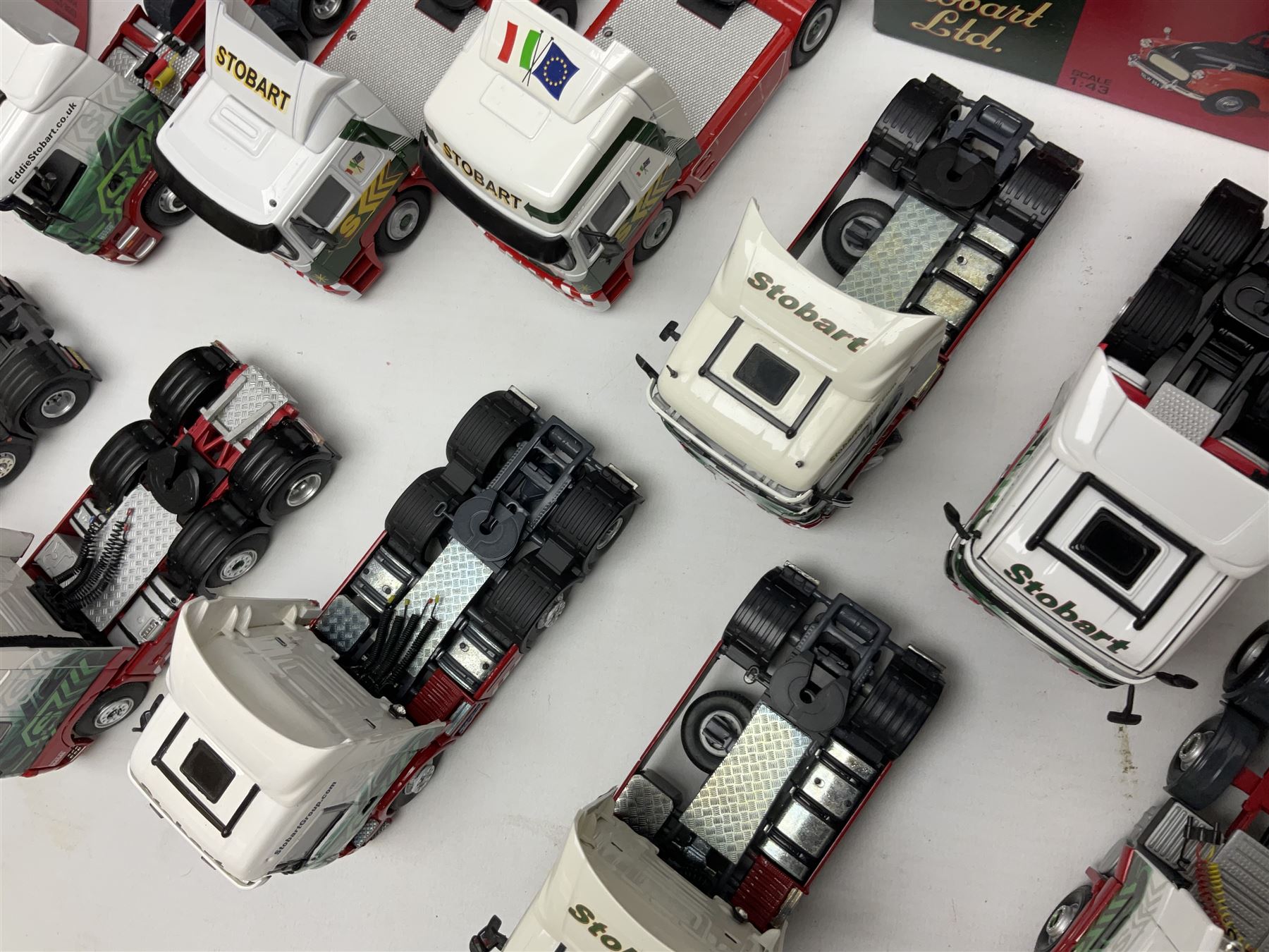 Eddie Stobart - three Oxford Die-Cast Super Rugby League lorries in perspex display cases including the two Hull Clubs; two Lledo Vanguard vans; two Days Gone vans; and Saico Truck & Trailer; all boxed; together with fourteen unboxed Corgi and other tractor/cab units etc (23)